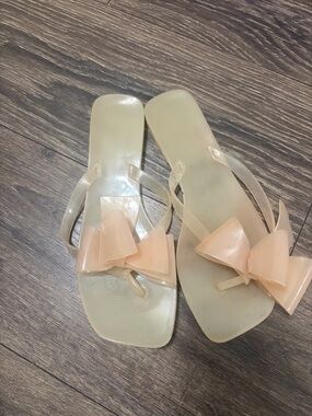 Women's Clear Bow Jelly Flip Flops in Nude